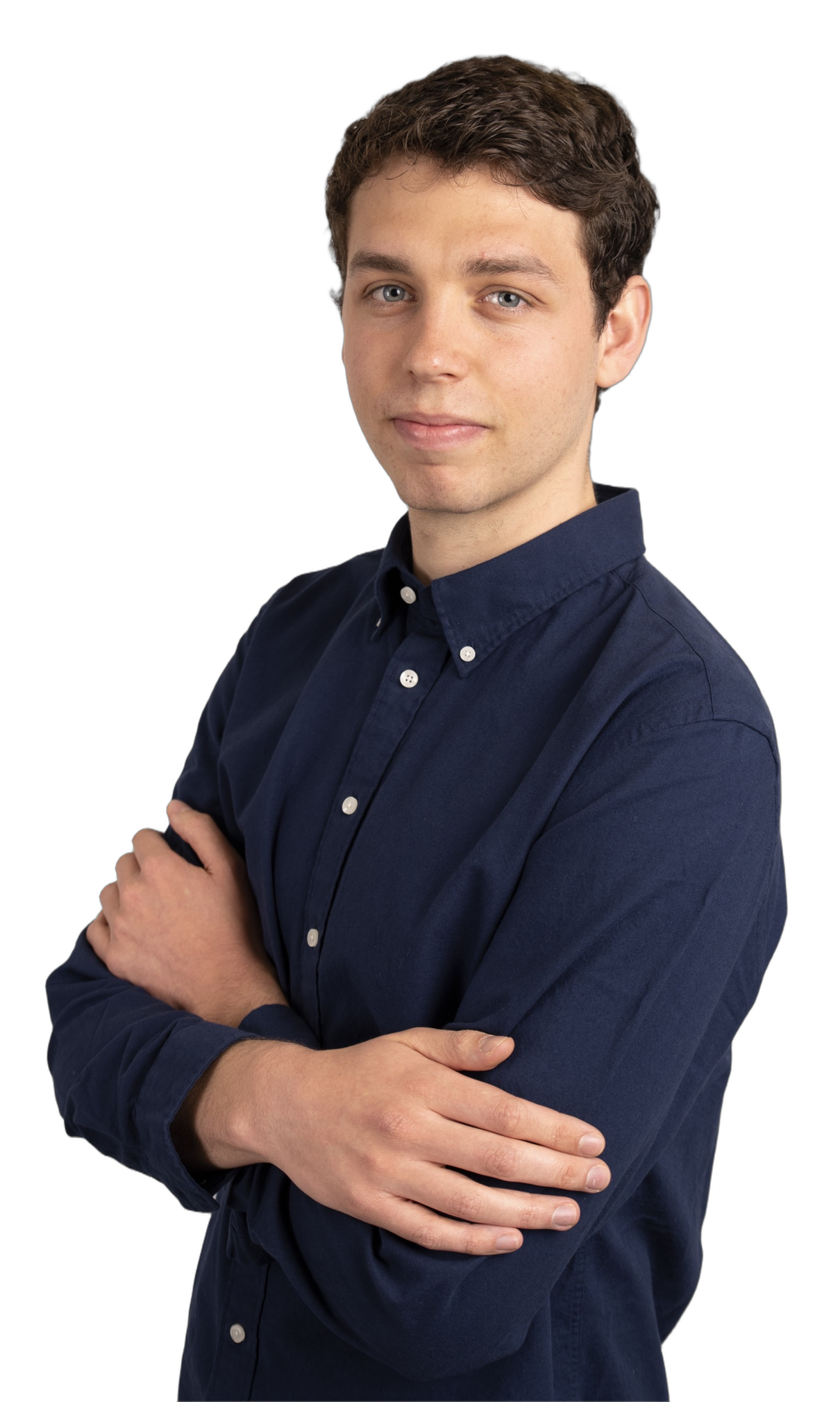 Pedro Morago, arms crossed, in a navy shirt